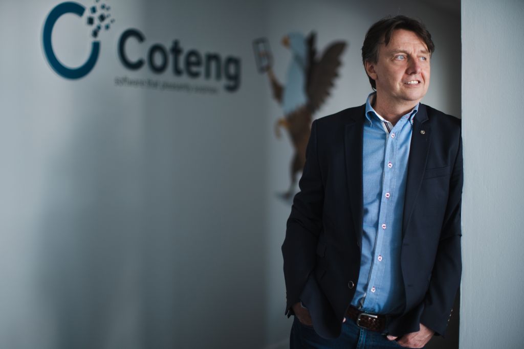 Didier in front of Coteng logo